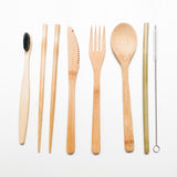 Reusable bamboo set includes spoon, fork, knife, chopsticks, straw, straw brush, and toothbrush.